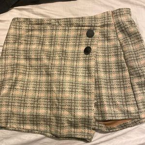 Green plaid skort with black buttons